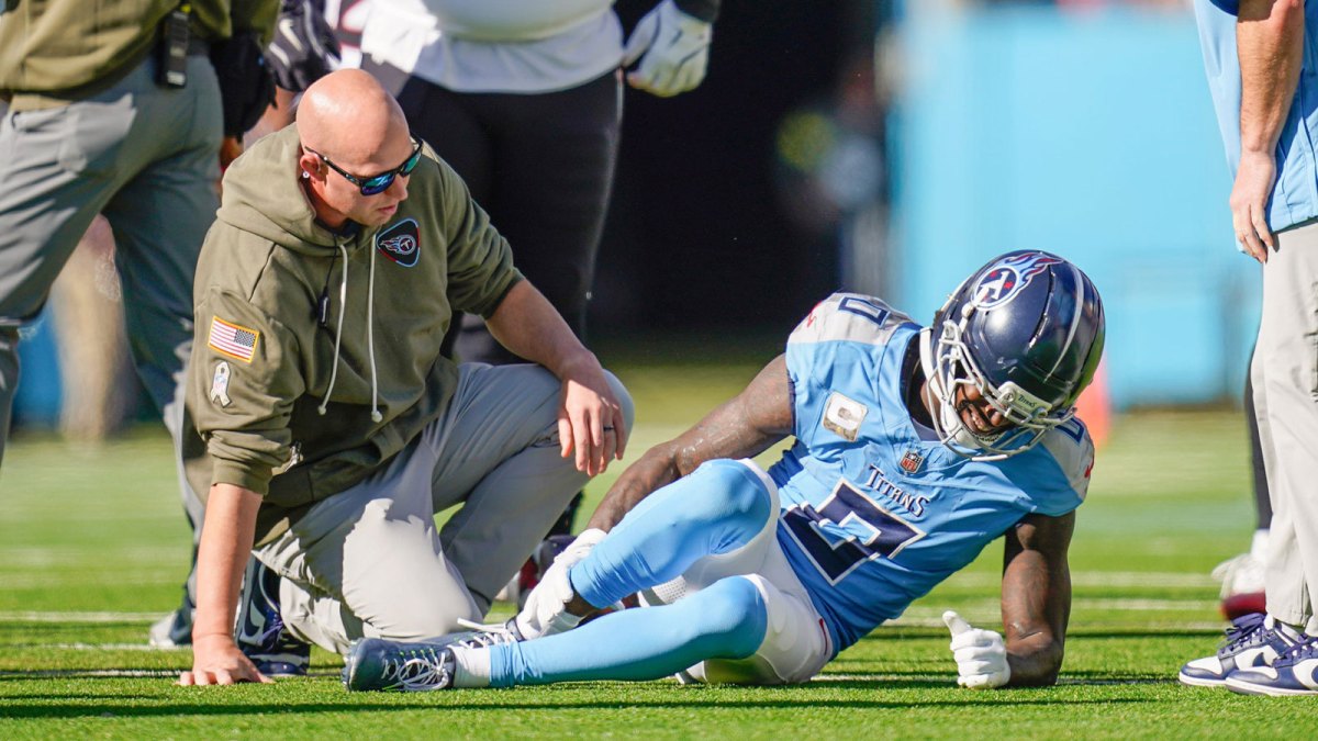 Tennessee Titans wide receiver Calvin Ridley (0) grabs his leg after the Titans offense’s first play of the game during the first quarter against the Houston Texans at Nissan Stadium in Nashville, Tenn., Sunday, Nov. 16, 2025.