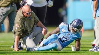 Tennessee Titans wide receiver Calvin Ridley (0) grabs his leg after the Titans offense’s first play of the game during the first quarter against the Houston Texans at Nissan Stadium in Nashville, Tenn., Sunday, Nov. 16, 2025.