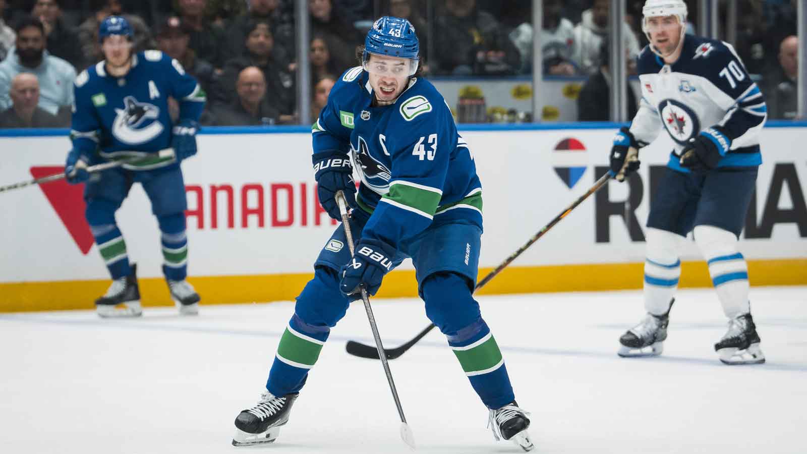 https://wp.clutchpoints.com/wp-content/uploads/2025/11/Canucks-defenseman-Quinn-Hughes-43-handles-the-puck.jpg