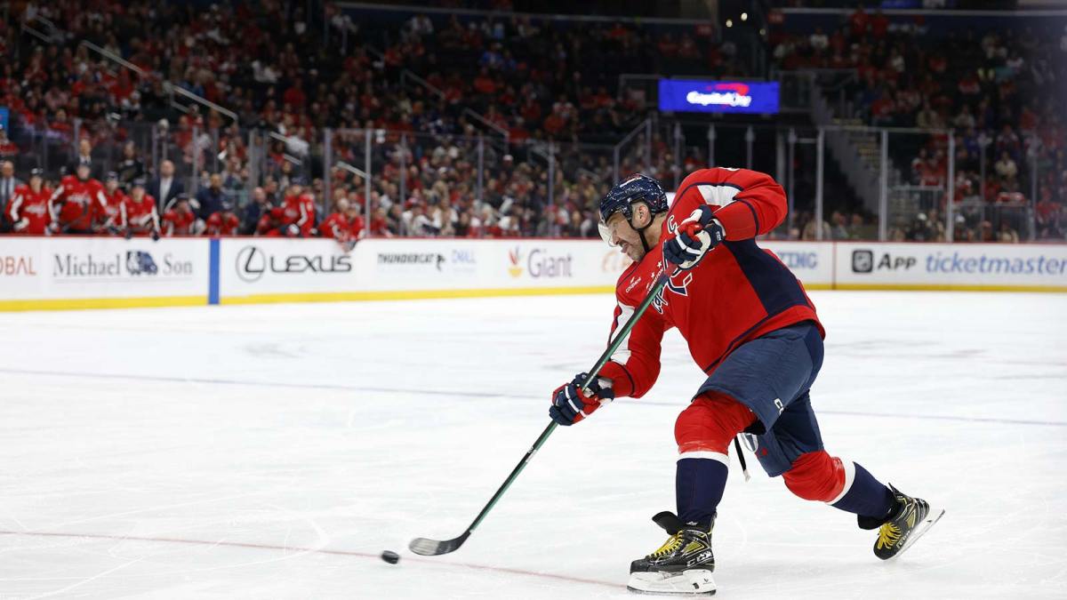 Washington Capitals left wing Alex Ovechkin (8) shoots the puck against the New York Islanders during the third period at Capital One Arena.