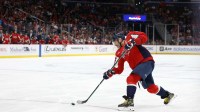 Washington Capitals left wing Alex Ovechkin (8) shoots the puck against the New York Islanders during the third period at Capital One Arena.