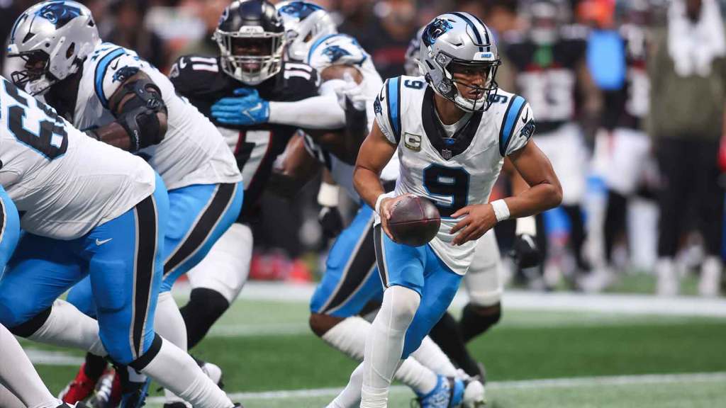 Carolina Panthers quarterback Bryce Young (9) hands the ball off in the fourth quarter against the Atlanta Falcons at Mercedes-Benz Stadium.