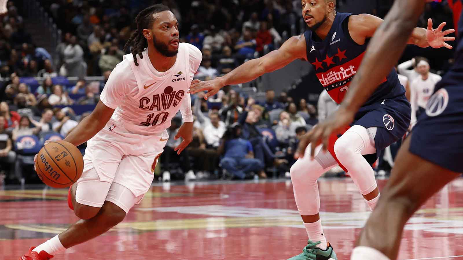 Cavaliers guard Darius Garland (10) drives to the basket as Washington Wizards guard CJ McCollum (3) defends in the second half in an Emirates NBA Cup game at Capital One Arena
