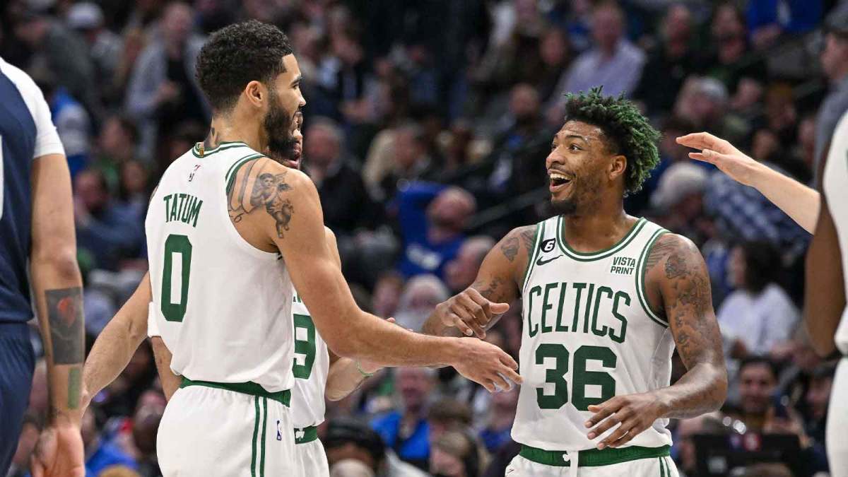 Celtics forward Jayson Tatum (0) and guard Marcus Smart (36) celebrates during the game between the Dallas Mavericks and the Boston Celtics at the American Airlines Center