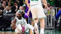 Boston Celtics guard Jaylen Brown (7) reacts after making a basket during the second half against the Utah Jazz at TD Garden.