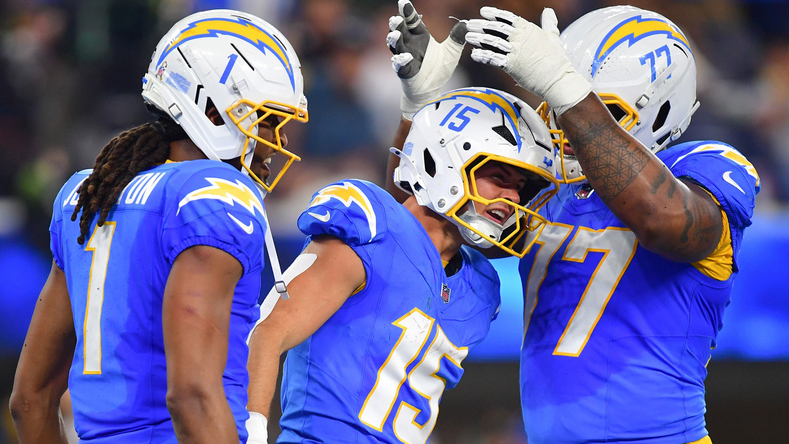 Los Angeles Chargers wide receiver Ladd McConkey (15) celebrates after scoring a touchdown against the Pittsburgh Steelers with wide receiver Quentin Johnston (1) and guard Zion Johnson (77) during the second quarter of the game at SoFi Stadium.