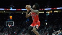Nov 19, 2025; Portland, Oregon, USA; Chicago Bulls guard Coby White (0) shoots a three-point basket during the first half against the Portland Trail Blazers at Moda Center. Mandatory Credit: Soobum Im-Imagn Images