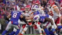 Buffalo Bills defensive end Joey Bosa sacks Kansas City Chiefs quarterback Patrick Mahomes with linebacker Terrel Bernard coming in to help during first half action against the Kansas City Chiefs