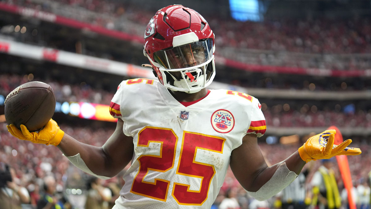 Glendale, Arizona, United States; Kansas City Chiefs running back Clyde Edwards-Helaire (25) shrugs as he walks into the end zone untouched for a score against the Arizona Cardinals at State Farm Stadium.