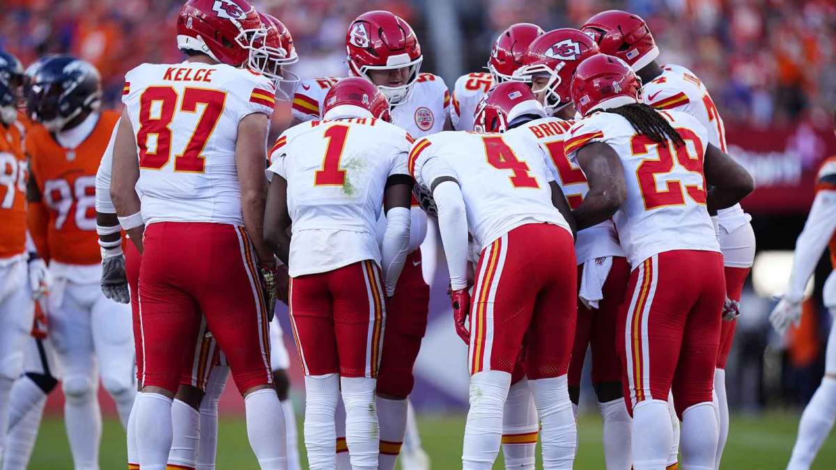 Members of the Kansas City Chiefs offensive squad huddle in the second quarter against the Denver Broncos at Empower Field at Mile High.