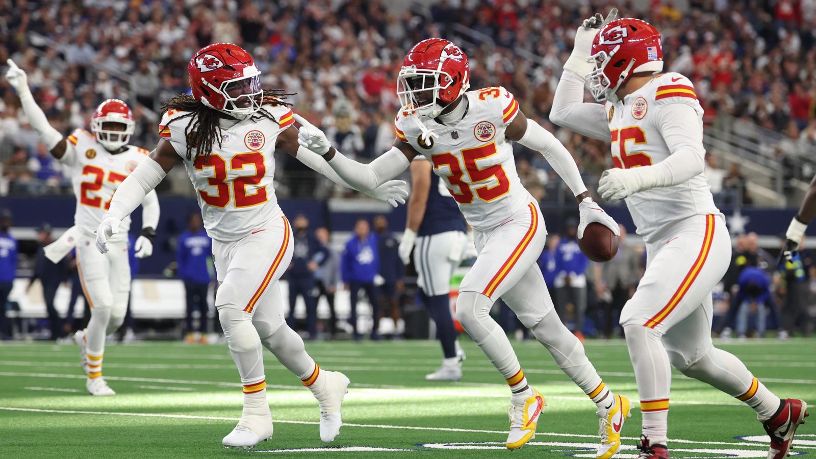 Kansas City Chiefs linebacker Nick Bolton (32) and Kansas City Chiefs cornerback Jaylen Watson (35) celebrate after an interception against the Dallas Cowboys during the first quarter at AT&T Stadium.