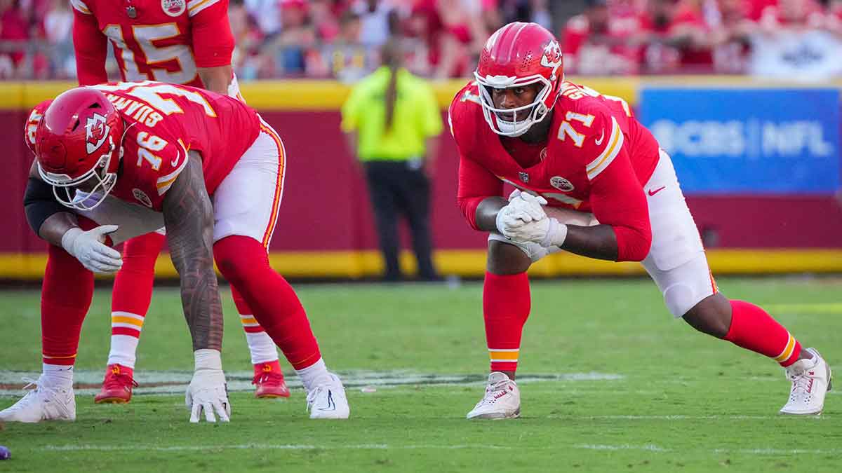 Kansas City Chiefs offensive tackle Kingsley Suamataia (76) and offensive tackle Josh Simmons (71) at the line of scrimmage against the Baltimore Ravens during the game at GEHA Field at Arrowhead Stadium.