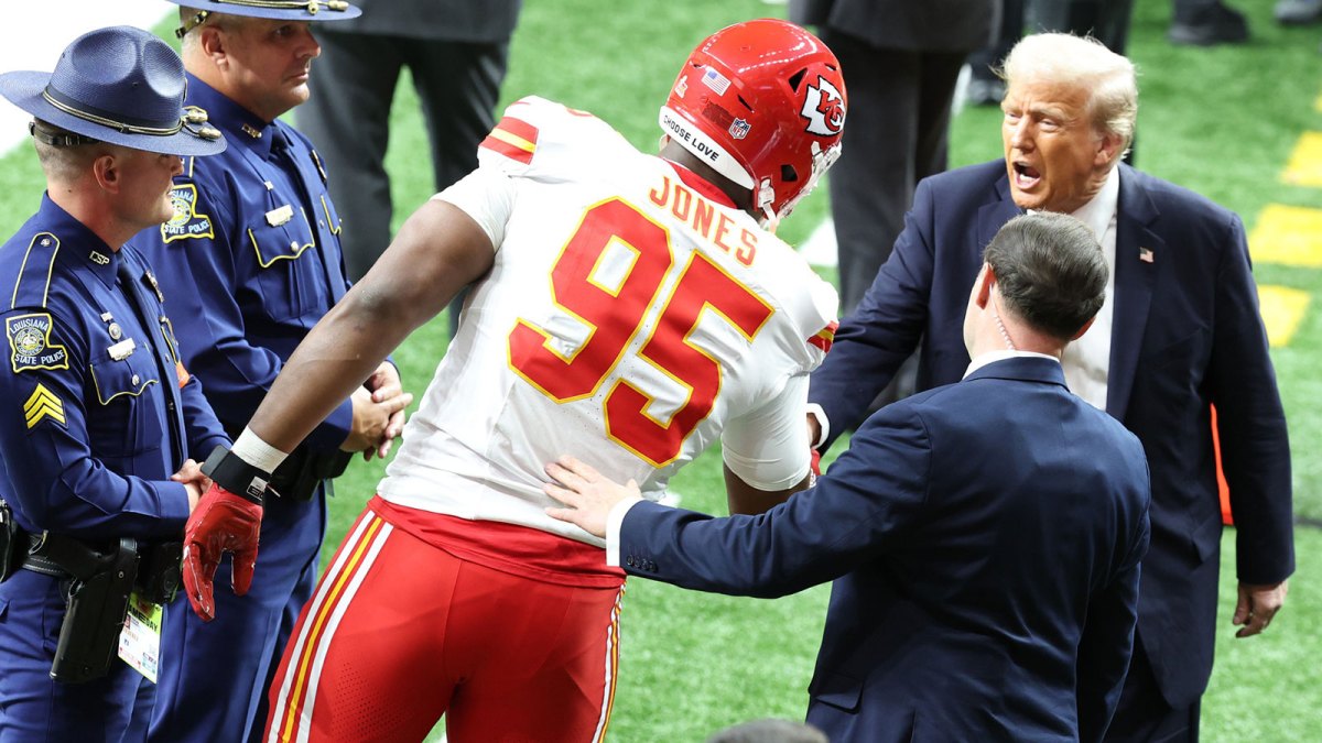 Kansas City Chiefs defensive tackle Chris Jones (95) greets President Donald Trump before playing against the Philadelphia Eagles in Super Bowl LIX at Ceasars Superdome.