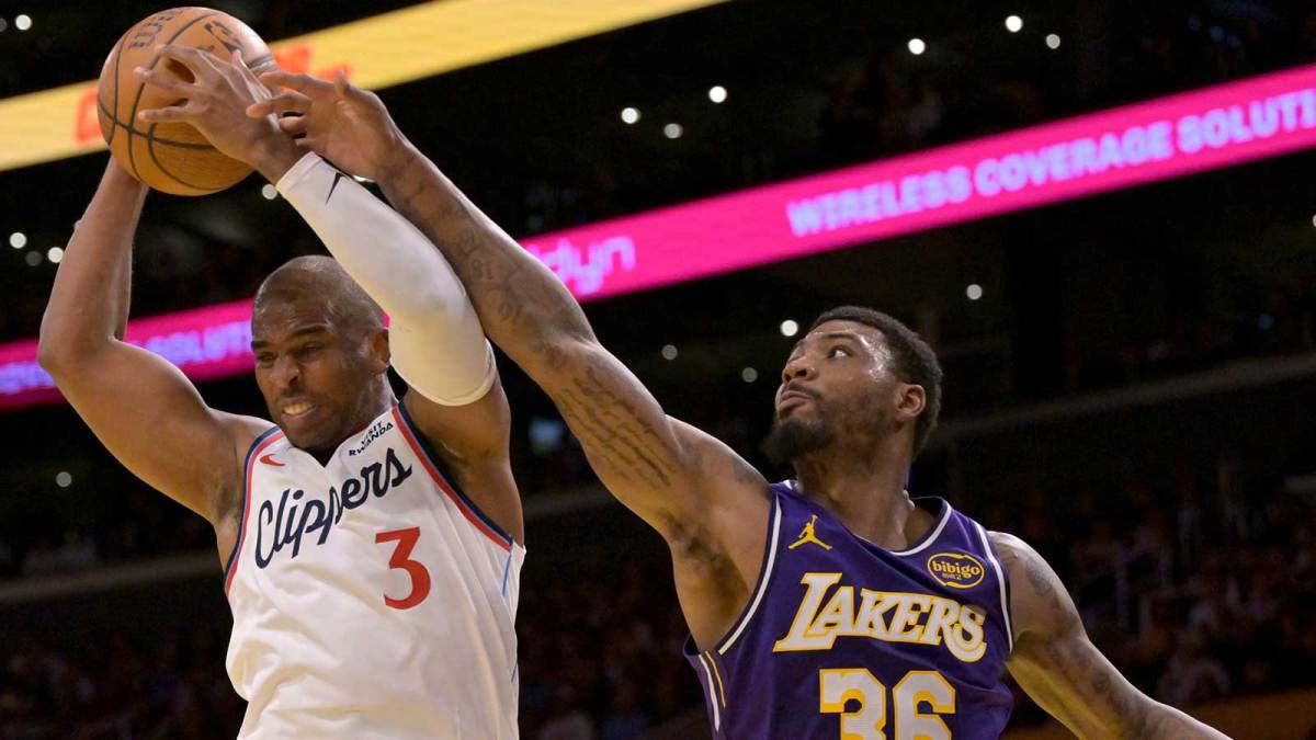 Los Angeles Clippers guard Chris Paul (3) beats Los Angeles Lakers guard Marcus Smart (36) to a rebound during the first half at Crypto.com Arena.