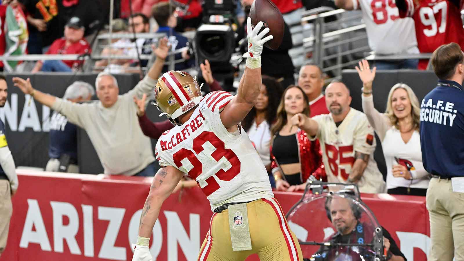 San Francisco 49ers running back Christian McCaffrey (23) celebrates scoring a touchdown in the second half against the Arizona Cardinals at State Farm Stadium. 