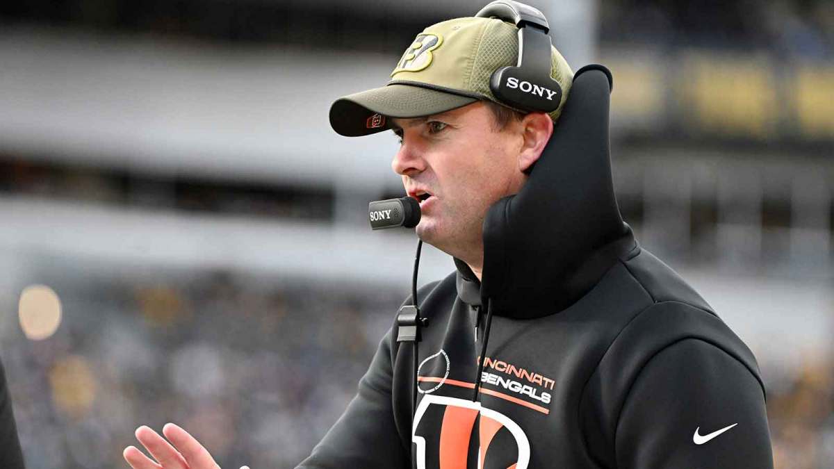 Cincinnati Bengals head coach Zac Taylor talks to an official following a play against the Pittsburgh Steelers during the first half at Acrisure Stadium.