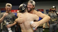 Los Angeles Dodgers pitcher Clayton Kershaw (22) and first baseman Enrique Hernandez (8) celebrate after defeating the Toronto Blue Jays in the 2025 MLB World Series at Rogers Centre