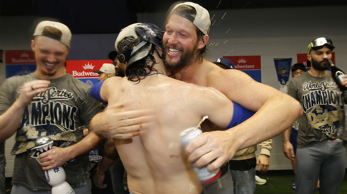 Los Angeles Dodgers pitcher Clayton Kershaw (22) and first baseman Enrique Hernandez (8) celebrate after defeating the Toronto Blue Jays in the 2025 MLB World Series at Rogers Centre