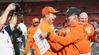 Clemson Tigers head coach Dabo Swinney, left, celebrates the Tigers' 20-19 win over host Louisville.
