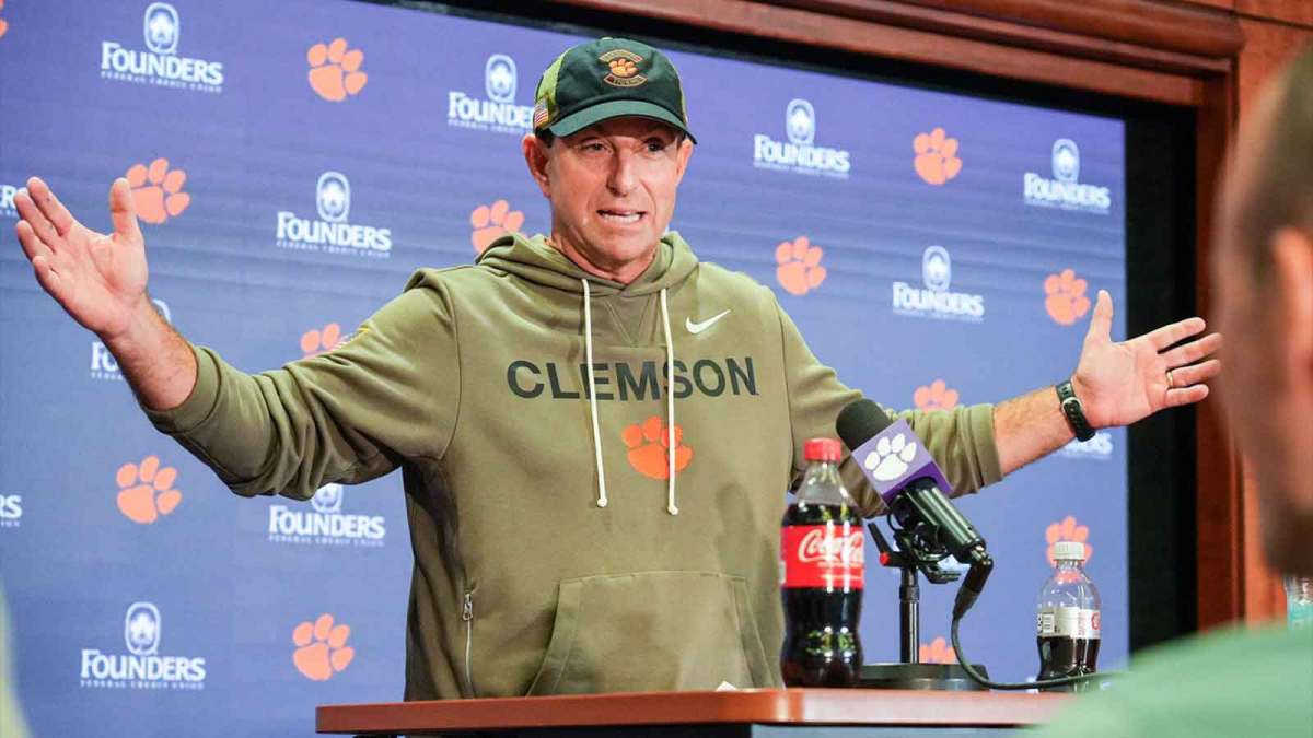 Clemson head coach Dabo Swinney with media after the game.