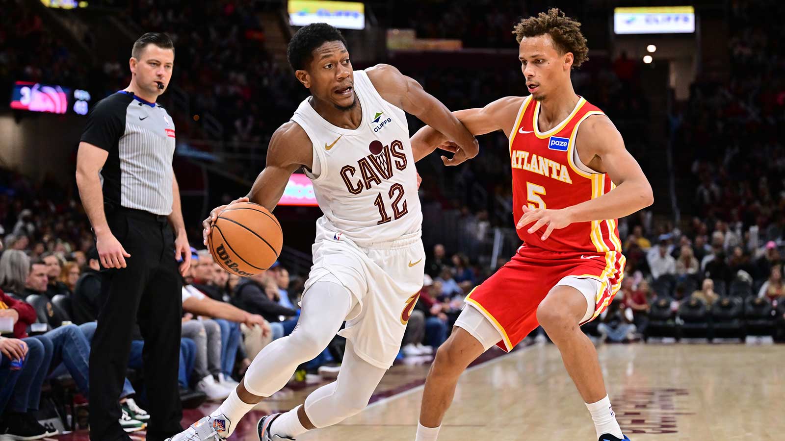 Cleveland Cavaliers forward De'Andre Hunter (12) drives to the basket against Atlanta Hawks guard Dyson Daniels (5) during the second half at Rocket Arena.