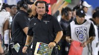Coastal Carolina Chanticleers head coach Tim Beck looks on from the sidelines in the first half against the UCLA Bruins at Rose Bowl.