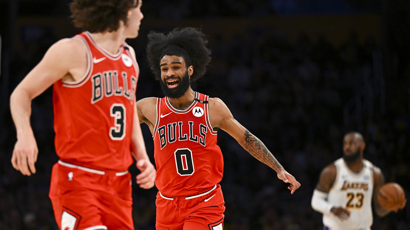 Chicago Bulls guard Coby White (0) reacts with Chicago Bulls guard Josh Giddey (3) against Los Angeles Lakers forward LeBron James (23) during the first half at Crypto.com Arena.