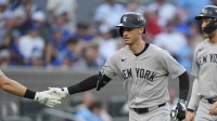 New York Yankees Cody Bellinger (35) is congratulated after hitting a two-run home run in the sixth inning against the Toronto Blue Jays during game two of the ALDS round for the 2025 MLB playoffs at Rogers Centre.