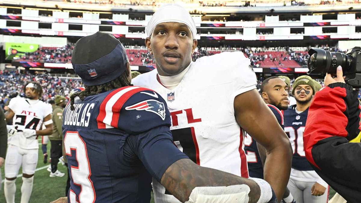 Atlanta Falcons quarterback Michael Penix Jr. (9) and New England Patriots wide receiver DeMario Douglas (3) hug after the game after the game at Gillette Stadium.