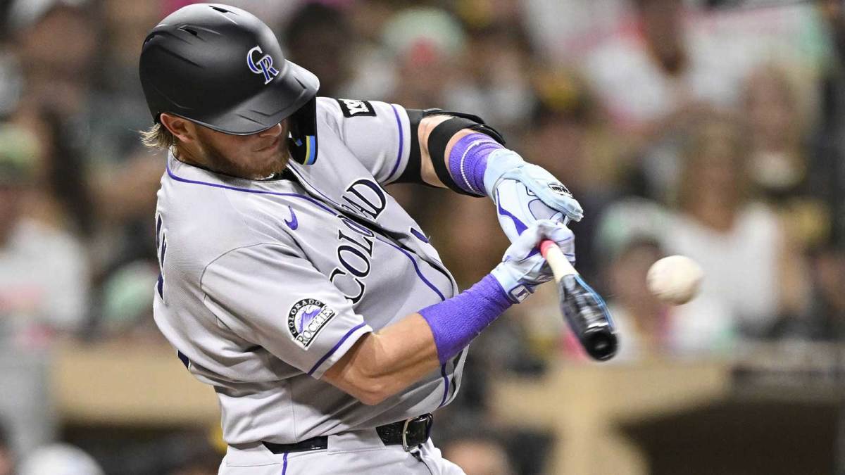 Colorado Rockies catcher Hunter Goodman (15) hits a single during the fourth inning against the San Diego Padres at Petco Park.