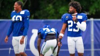 Indianapolis Colts cornerbacks Kenny Moore II (23) and Jaylon Jones (40) make their way onto the field Monday, July 28, 2025, ahead of training camp held at Grand Park in Westfield.