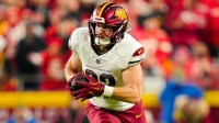Washington Commanders tight end Ben Sinnott (82) runs with the ball during the first half against the Kansas City Chiefs at GEHA Field at Arrowhead Stadium.