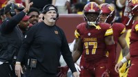 Washington Commanders head coach Dan Quinn (L) stands with Commanders wide receiver Terry McLaurin (17) on the sidelines against the Las Vegas Raiders during the third quarter at Northwest Stadium.