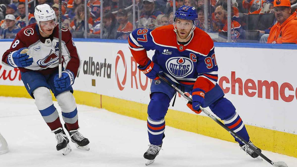 Edmonton Oilers forward Connor McDavid (97) looks to make a pass in front og Colorado Avalanche defensemen Cale Makar (8) during the third period at Rogers Place