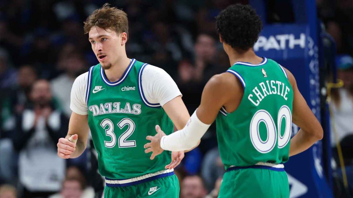 Dallas Mavericks forward Cooper Flagg (32) celebrates with Dallas Mavericks guard Max Christie (00) during the first quarter against the Milwaukee Bucks at American Airlines Center.