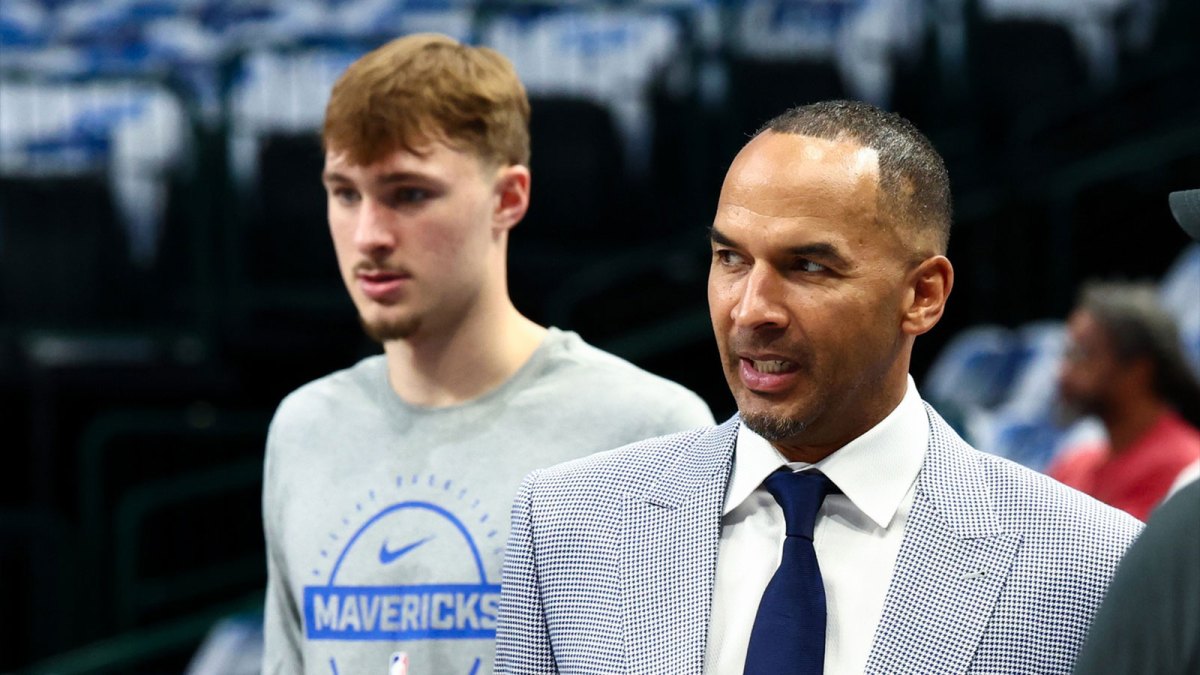 Dallas Mavericks general manager Nico Harrison and Dallas Mavericks forward Cooper Flagg (32) before the game against the San Antonio Spurs at American Airlines Center.