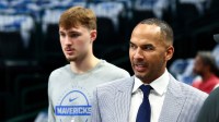 Dallas Mavericks general manager Nico Harrison and Dallas Mavericks forward Cooper Flagg (32) before the game against the San Antonio Spurs at American Airlines Center.