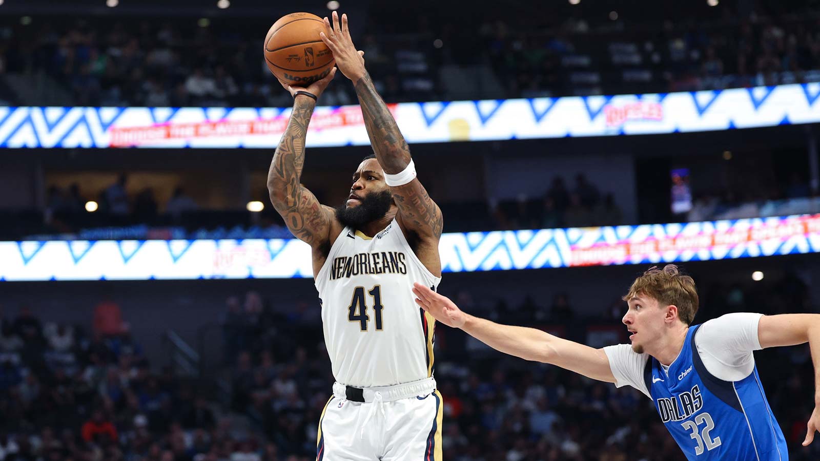 New Orleans Pelicans guard Saddiq Bey (41) shoots past Dallas Mavericks forward Cooper Flagg (32) during the first quarter at American Airlines Center. Mandatory Credit: Kevin Jairaj-Imagn Images