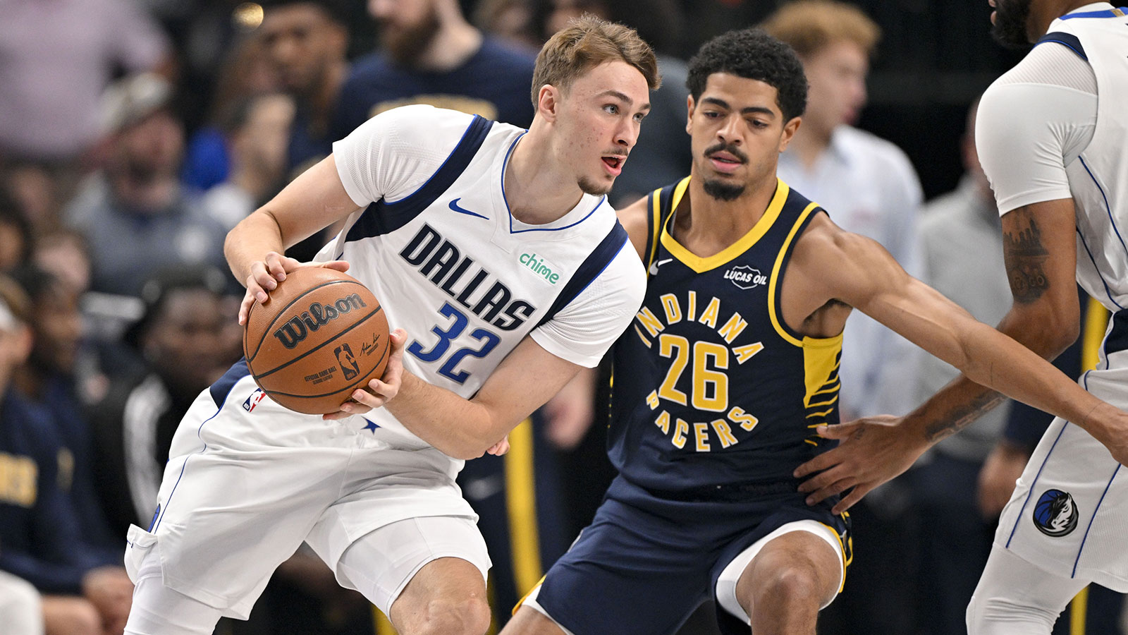 Dallas Mavericks forward Cooper Flagg (32) moves to the basket past Indiana Pacers guard Ben Sheppard (26) during the first quarter at the American Airlines Center.