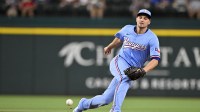Texas Rangers shortstop Corey Seager (5) cannot field a ball hit by Cleveland Guardians second baseman Brayan Rocchio (not pictured) during the second inning at Globe Life Field.