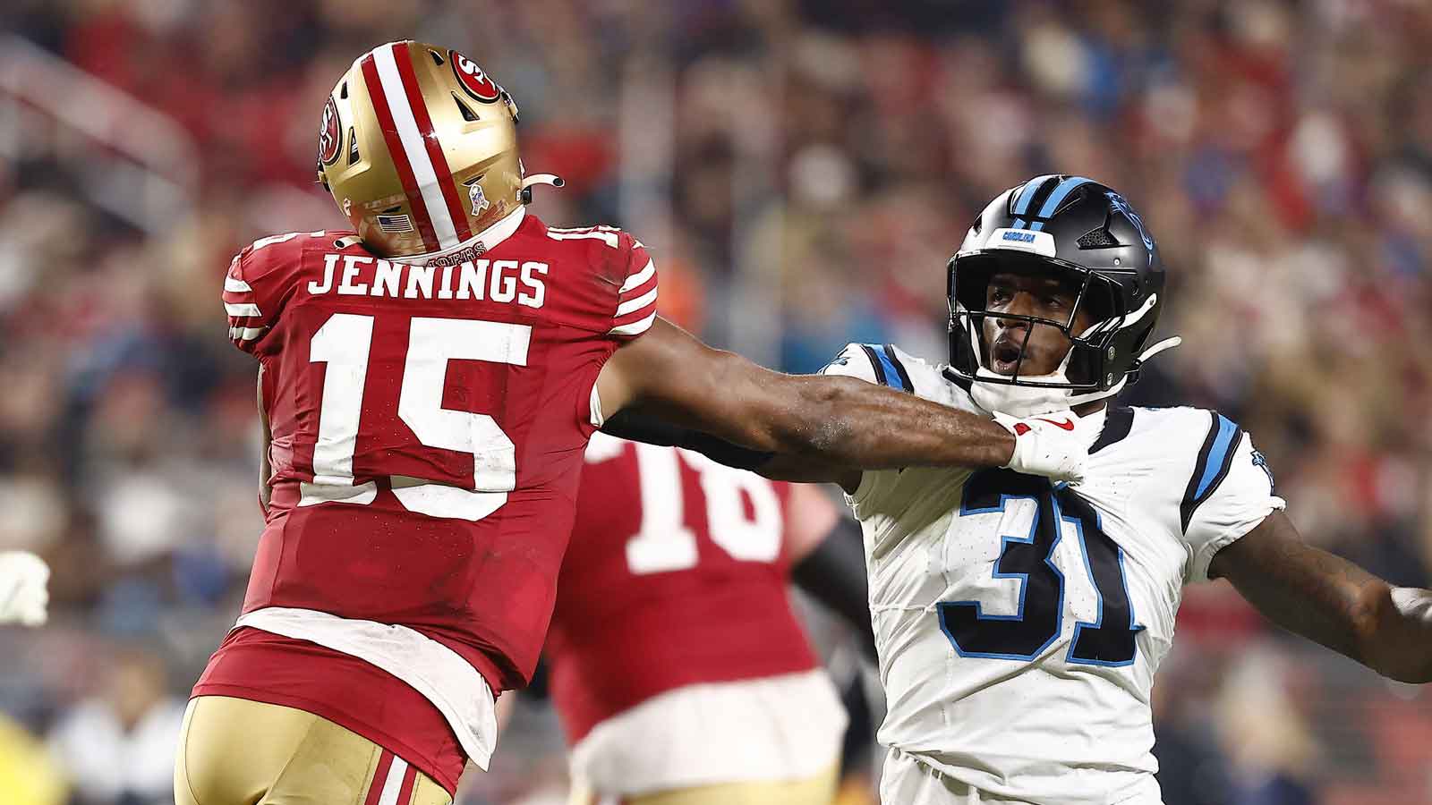San Francisco 49ers wide receiver Jauan Jennings (15) and Carolina Panthers cornerback Corey Thornton (31) shove each other during the second half at Levi's Stadium.
