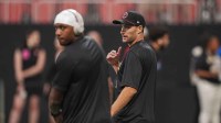 Atlanta Falcons quarterbacks Michael Penix Jr. (9) and Kirk Cousins (18) on the field prior to the game against the Pittsburgh Steelers at Mercedes-Benz Stadium.