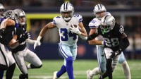 Dallas Cowboys running back Malik Davis (34) runs the ball against the Las Vegas Raiders in the first quarter at AT&T Stadium.