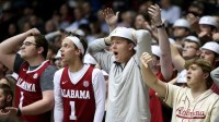 Alabama fans react to an officials call that went against Alabama in the game against Mississippi State at Coleman Coliseum.