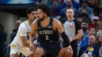 Detroit Pistons guard Cade Cunningham (2) dribbles the ball while Indiana Pacers guard Ben Sheppard (26) defends in the first half at Gainbridge Fieldhouse.