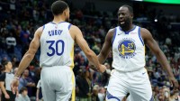 Golden State Warriors forward Draymond Green (23) celebrates with guard Stephen Curry (30) during the first half against the New Orleans Pelicans at Smoothie King Center.