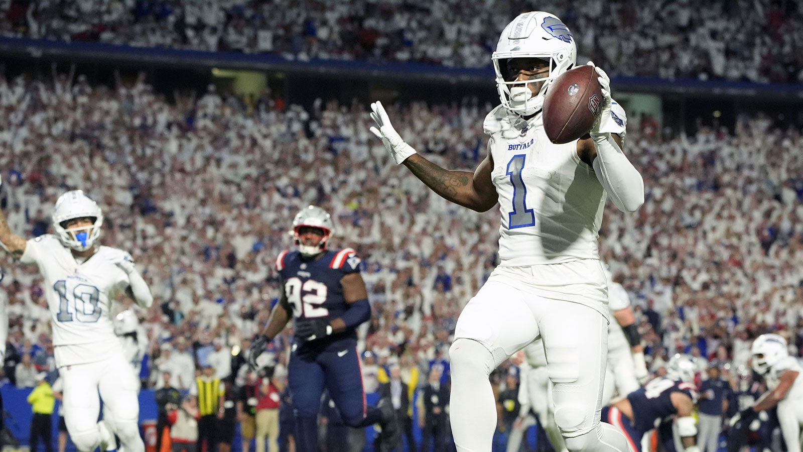 Buffalo Bills wide receiver Curtis Samuel (1) scores a touchdown against the New England Patriots during the second half at Highmark Stadium. 