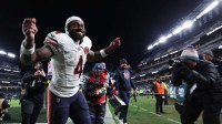 Chicago Bears running back D'Andre Swift (4) celebrates as he leaves the field after the game against the Philadelphia Eagles at Lincoln Financial Field.