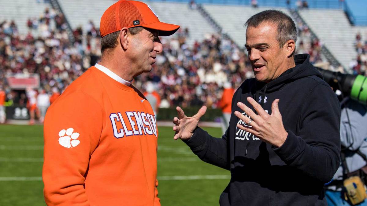 Clemson Tigers head coach Dabo Swinney and South Carolina Gamecocks head coach Shane Beamer chat before their game at Williams-Brice Stadium.
