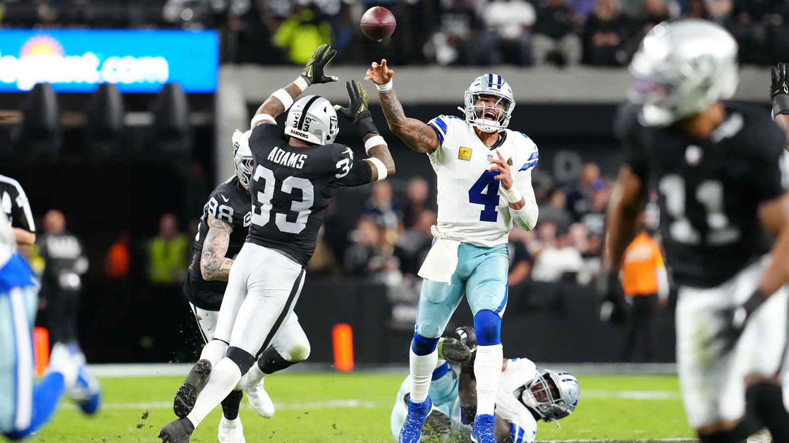 Dallas Cowboys quarterback Dak Prescott (4) throws a pass during the first half against the Las Vegas Raiders at Allegiant Stadium.